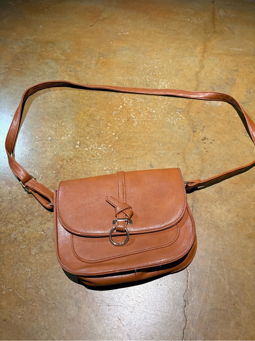 Minimalist Tan Crossbody Saddle Bag with Ring Accent